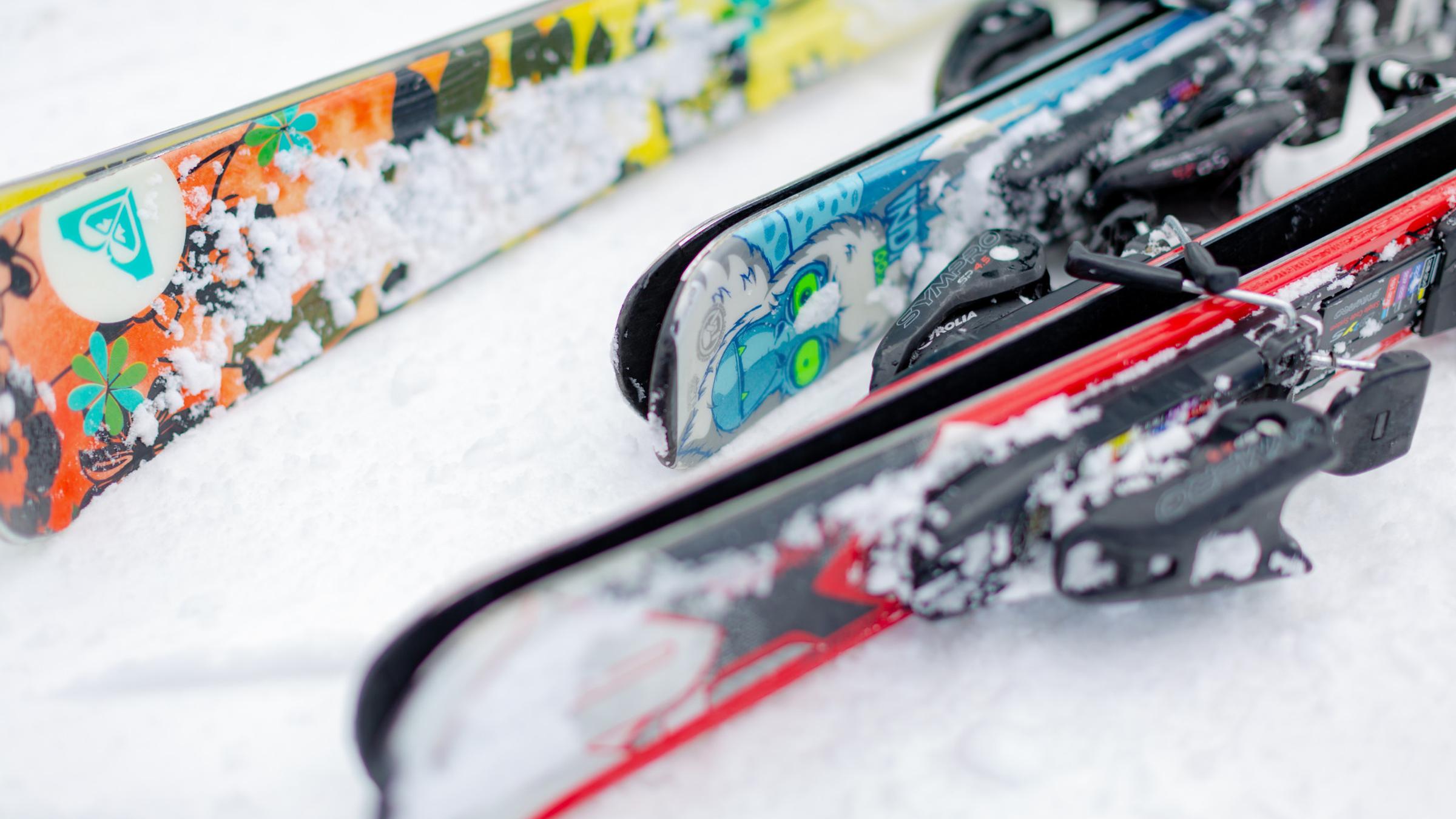 Skis laying on the snow.
