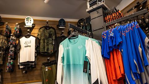 MTB clothes hanging in a store