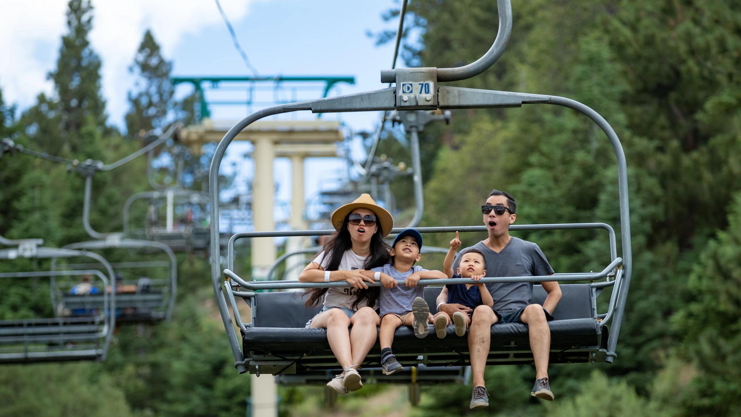 Asian family on Skychair amazed by the beautiful view. 