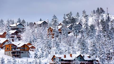 Scenic photo of houses covered in snow