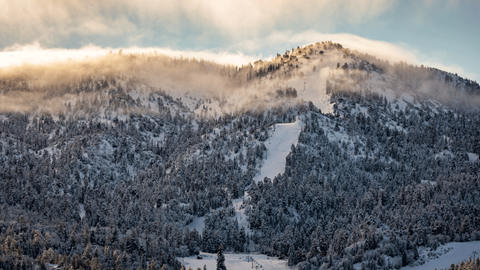 Geronimo ski run at Bear Mountain in the winter months from a drone view