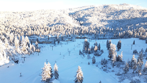 Scenic drone view of Snow Valley's main slopes covered in snow