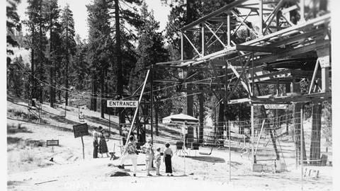 Guests standing at the entrance to the single chair chairlift at the base of Snow Valley during the summer months.