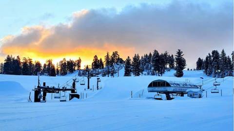 View of Snow Valley's base area and ski resort during a sunset