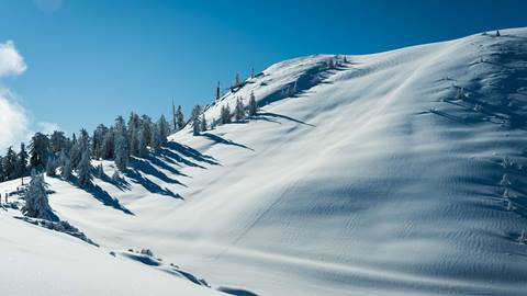 Bluebird day and untouched Slide Peak blanketed in fresh snow
