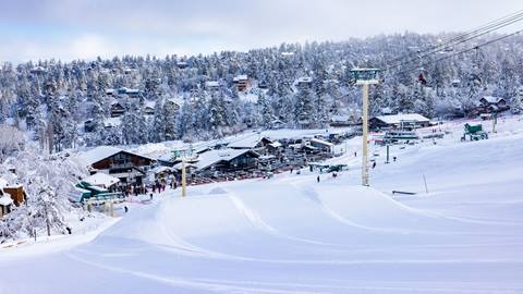 Bear Mountain lower park run jump looking at the base area after snowfall