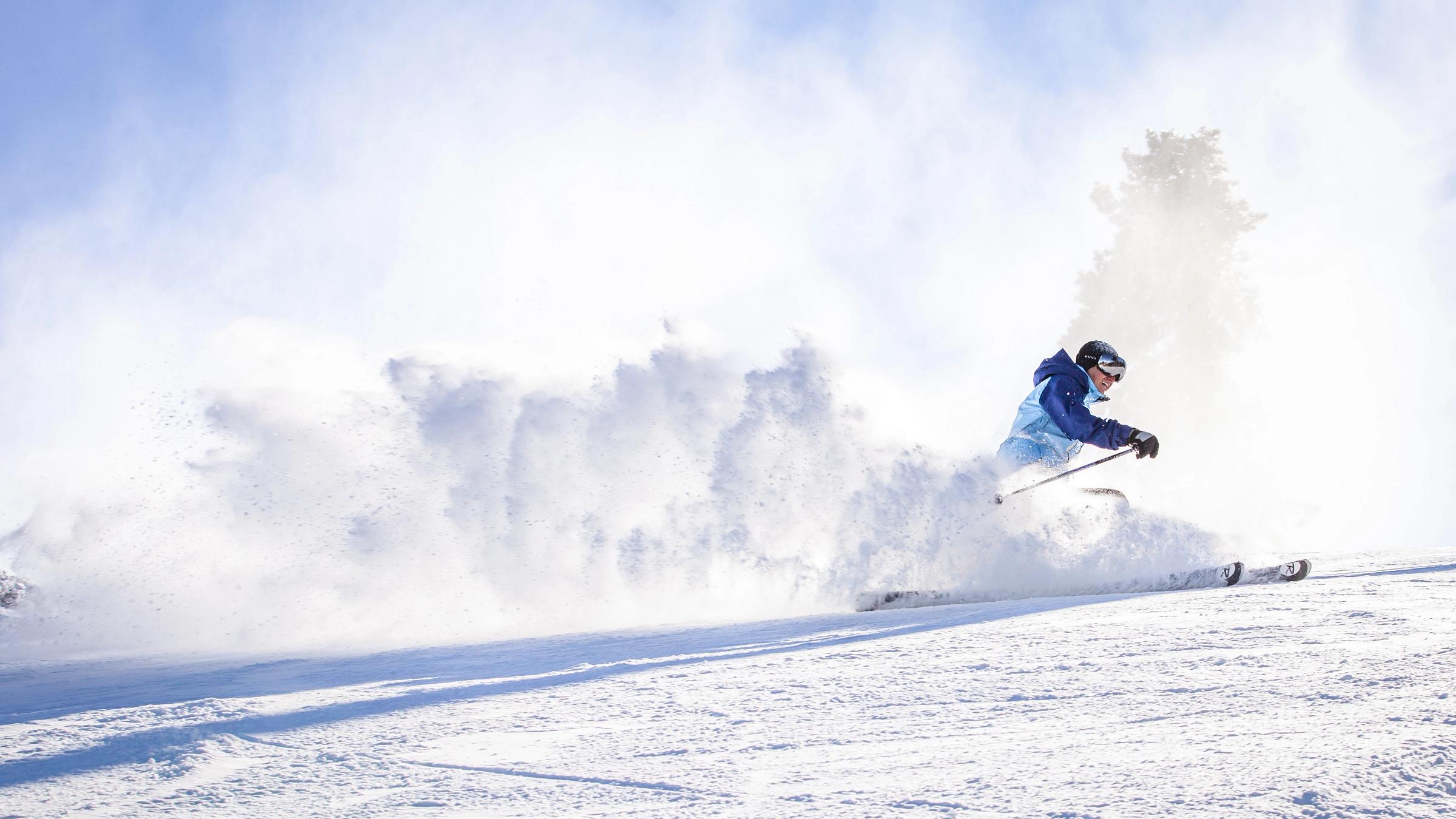 Man carving in fresh snow