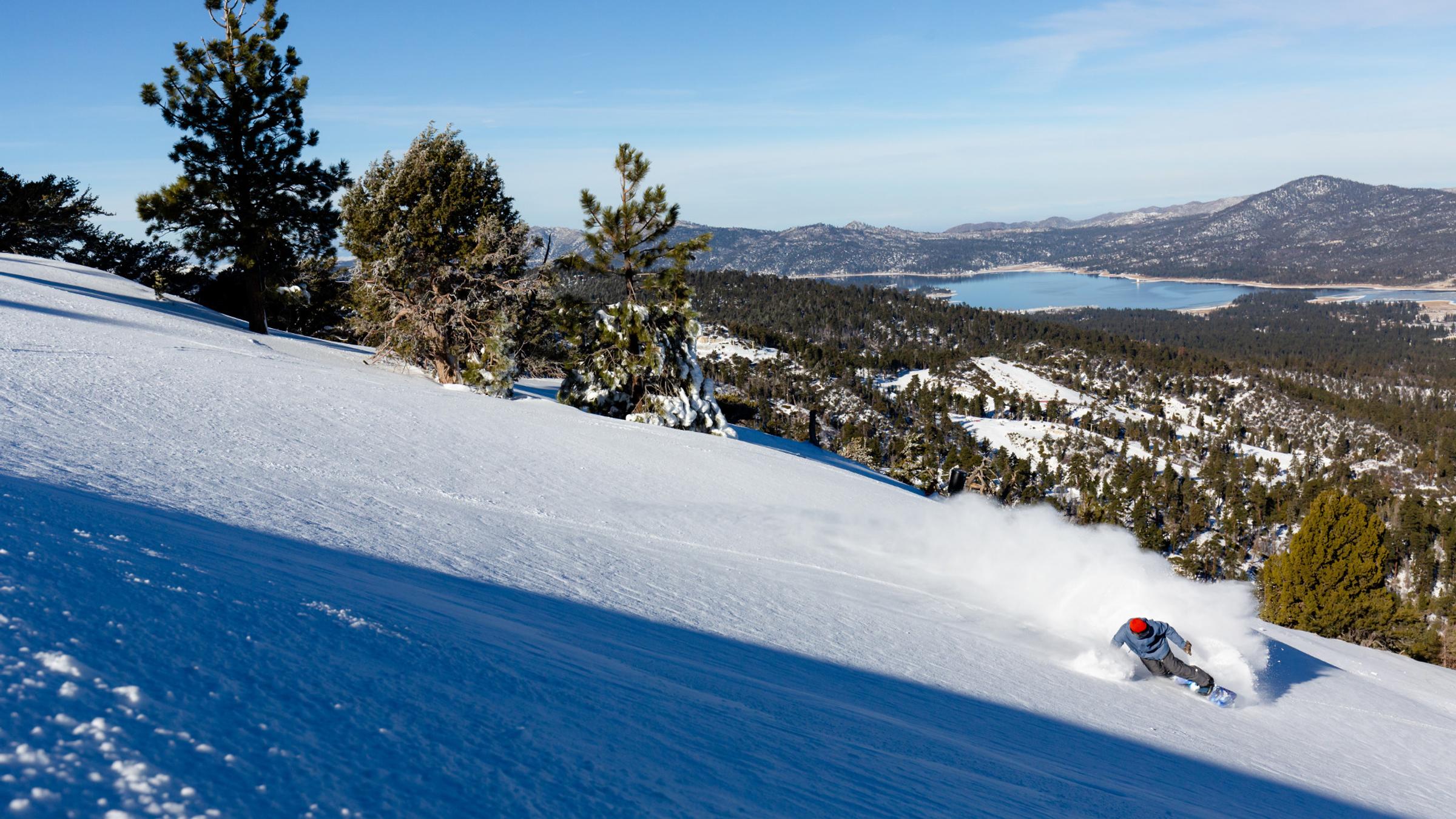 Snowboarder slashing powder