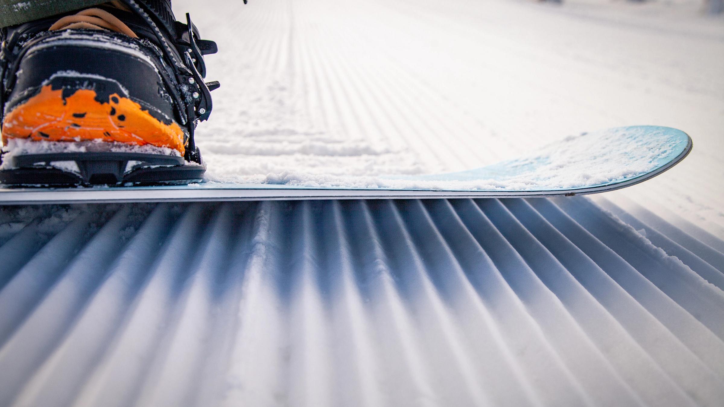 Snowboarder on corduroy