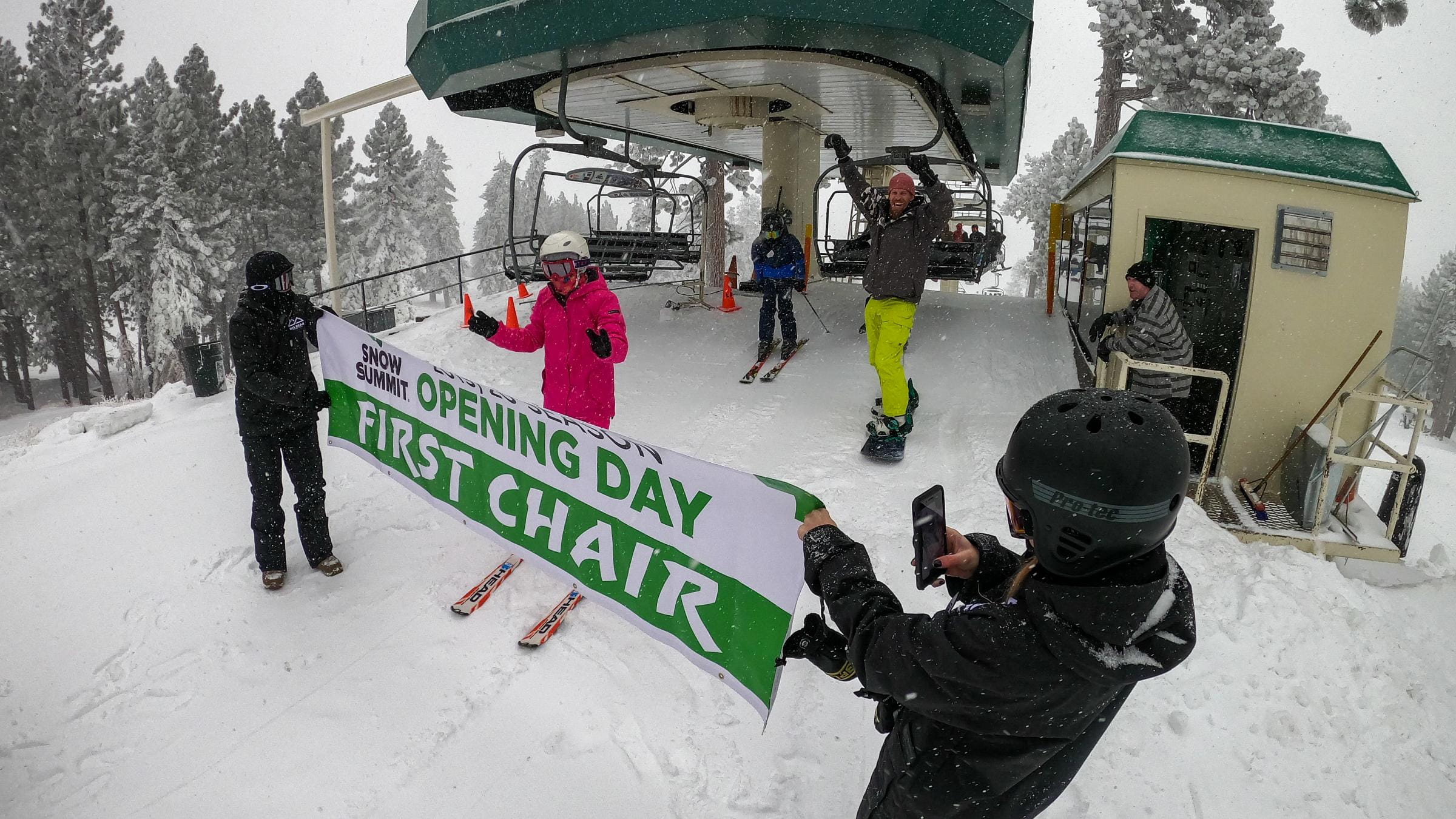 skier going through "First Chair" sign