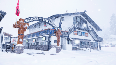 Snowy day at Bear Mountain's front entrance sign
