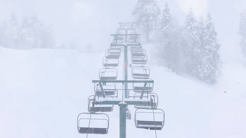 Ariel shot of a chairlift on a snow day