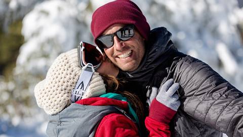 A couple kissing in the snow