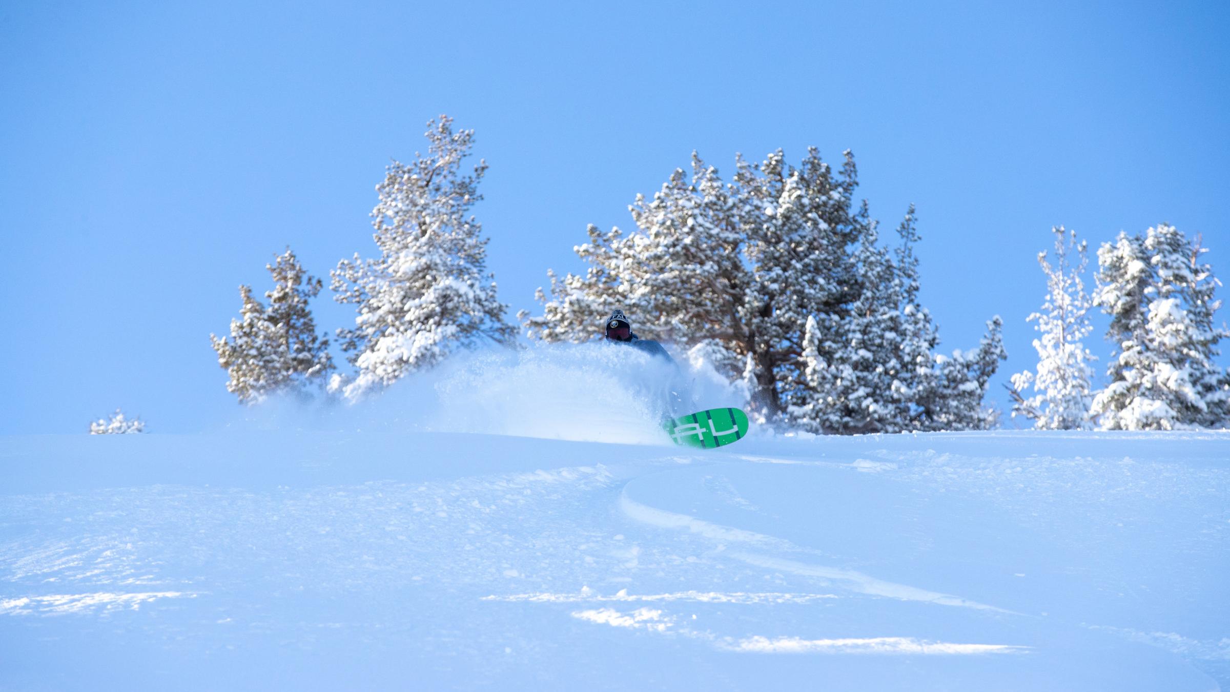 Snowboarder shredding in fresh powder