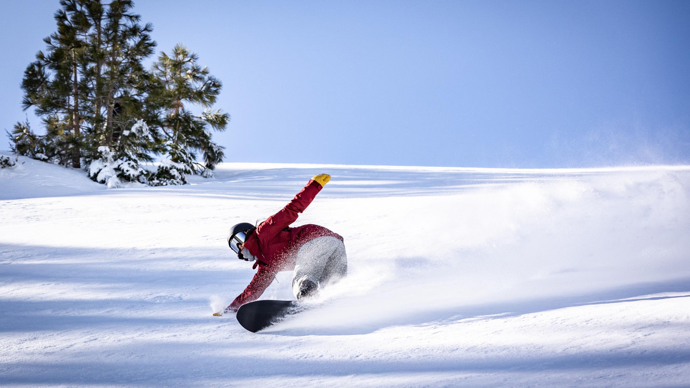Snowboarder shredding in fresh powder