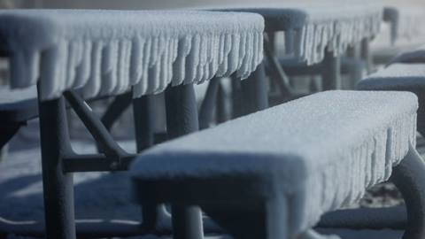 Frosty and freshly covered bench with new snow.