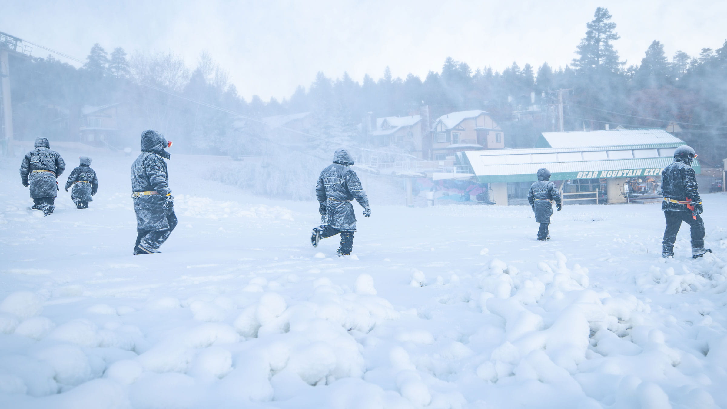 Crew of six workers checking the newly laid snow at Bear Mountain.