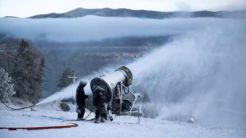 Snowmaking in the early morning at Snow Summit in the winter months with the lake view in the background