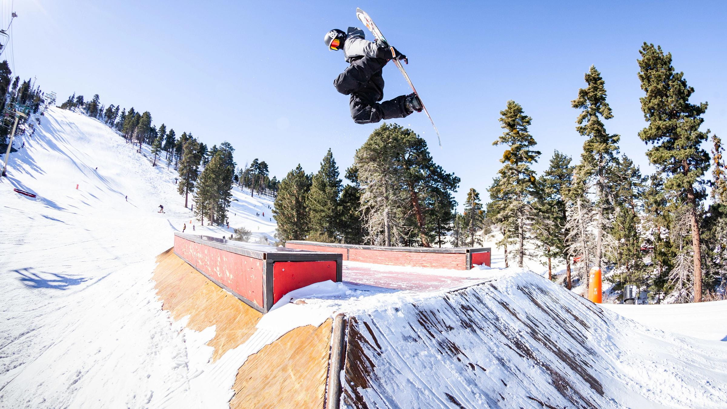 Snowboarder doing a trick on a feature