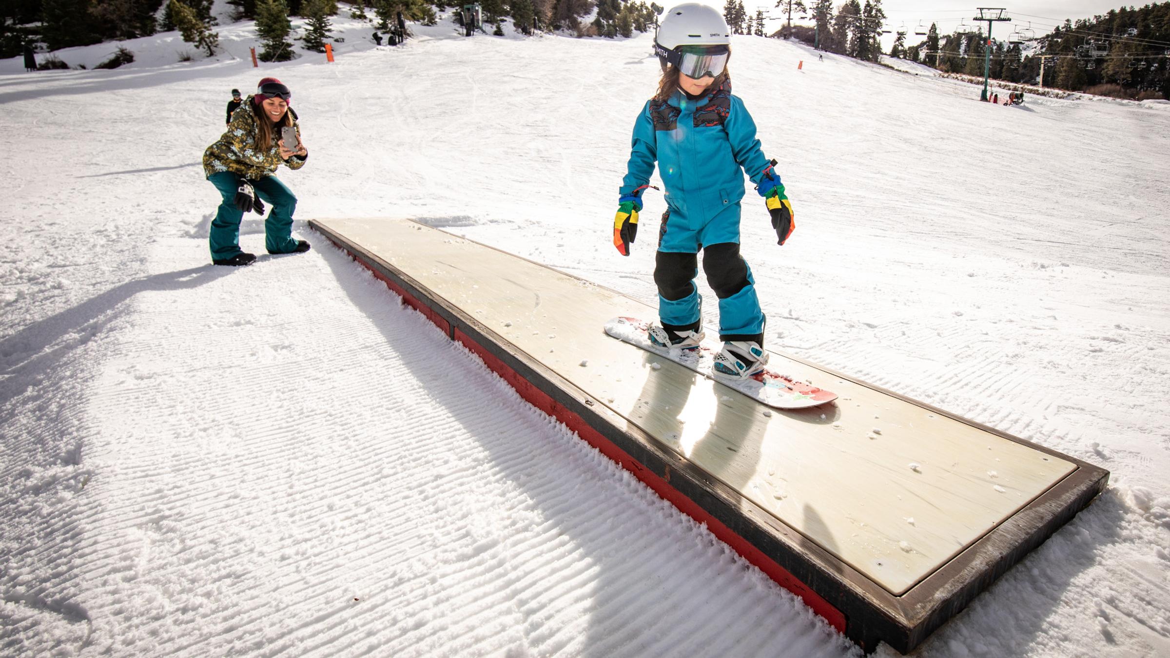 Snowboarder on two features