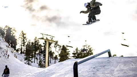 Snowboarder on rail
