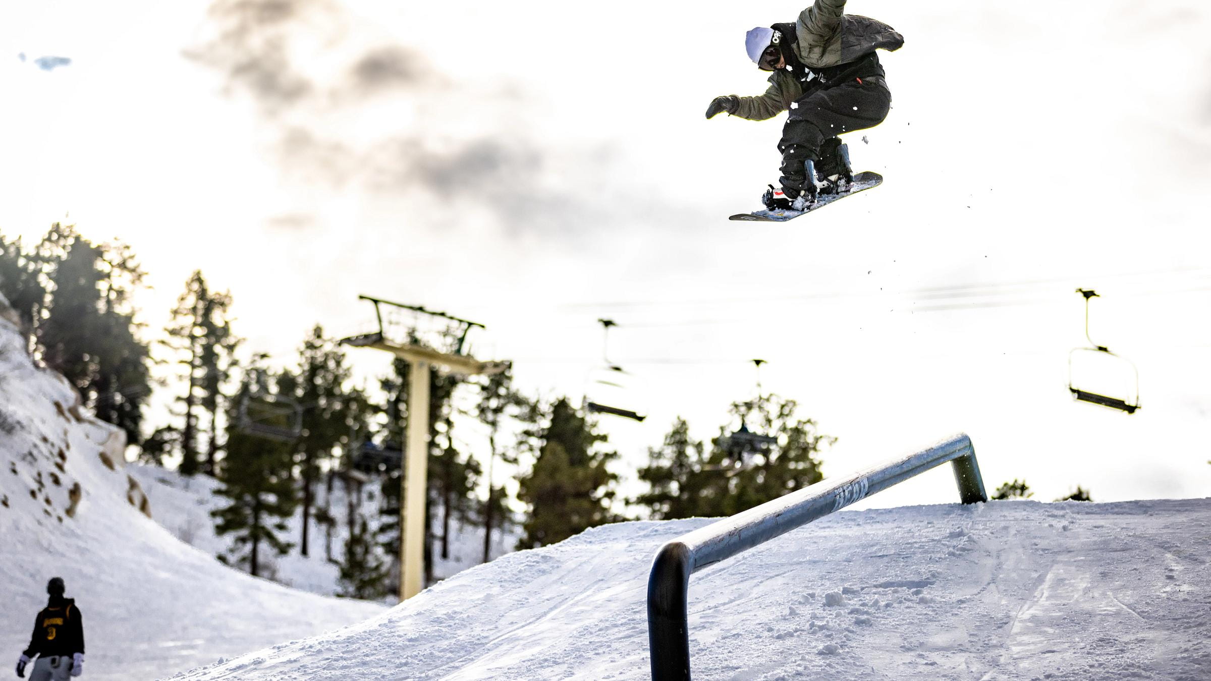 Snowboarder on rail