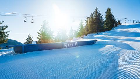 A flat blue box at Snow Valley with the sun shining 