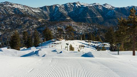 Terrain park features in the snow at snow valley in the winter with mountain view in the background