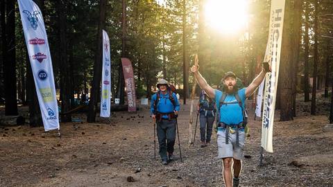 Couple of guys outdoors walking, wearing hiking gear in big bear lake, ca
