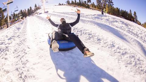 Man riding the tube park