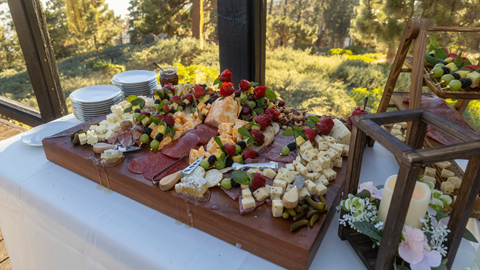 Cheese platter on a table set for a wedding reception