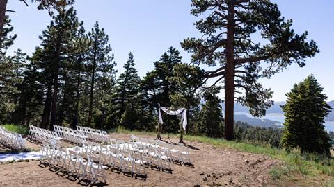 Outdoor ceremony set up in the dirt top of the forest