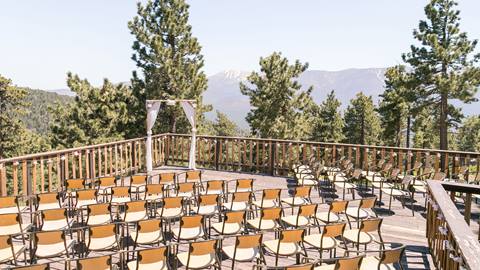 Ceremony set up on an outdoor deck in the forest