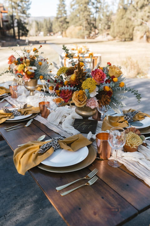 Catering table set up for wedding reception outdoors in the mountains
